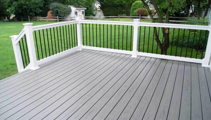 A deck railing and cover system in Northeast Ohio, providing safety and privacy for the outdoor space while adding a touch of elegance and style